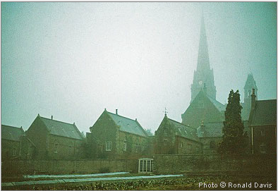 St. Hugh’s Charterhouse, Parkminster, with the church spire rising above the hermitages. England, winter 1983. © Photo by Ronald Davis.